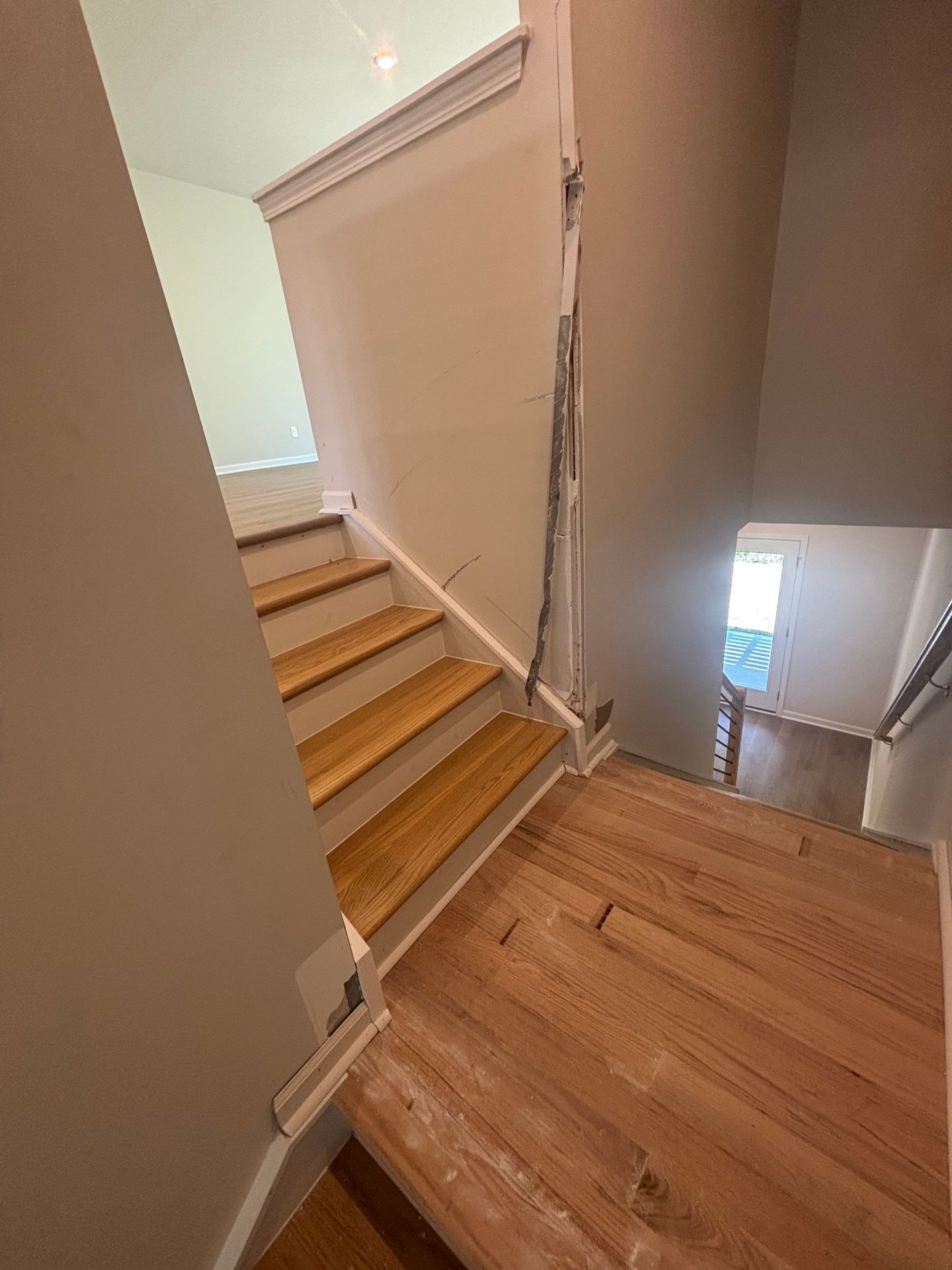 Drywall Repair — interior stairwell with freshly painted greige walls and white trim in Chapel Hill, NC