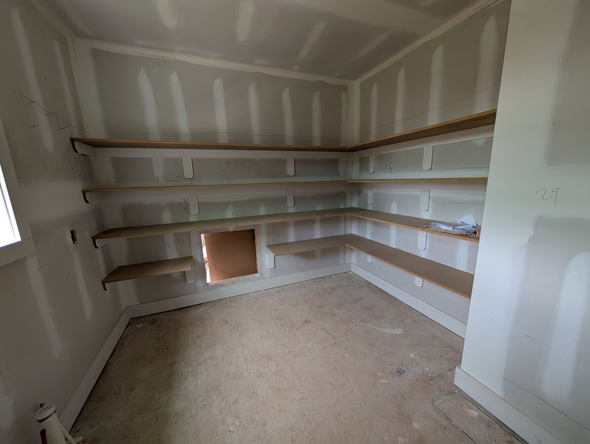 Drywall Repair — closet with fresh prime coat and exposed drywall substrate in Cary, NC
