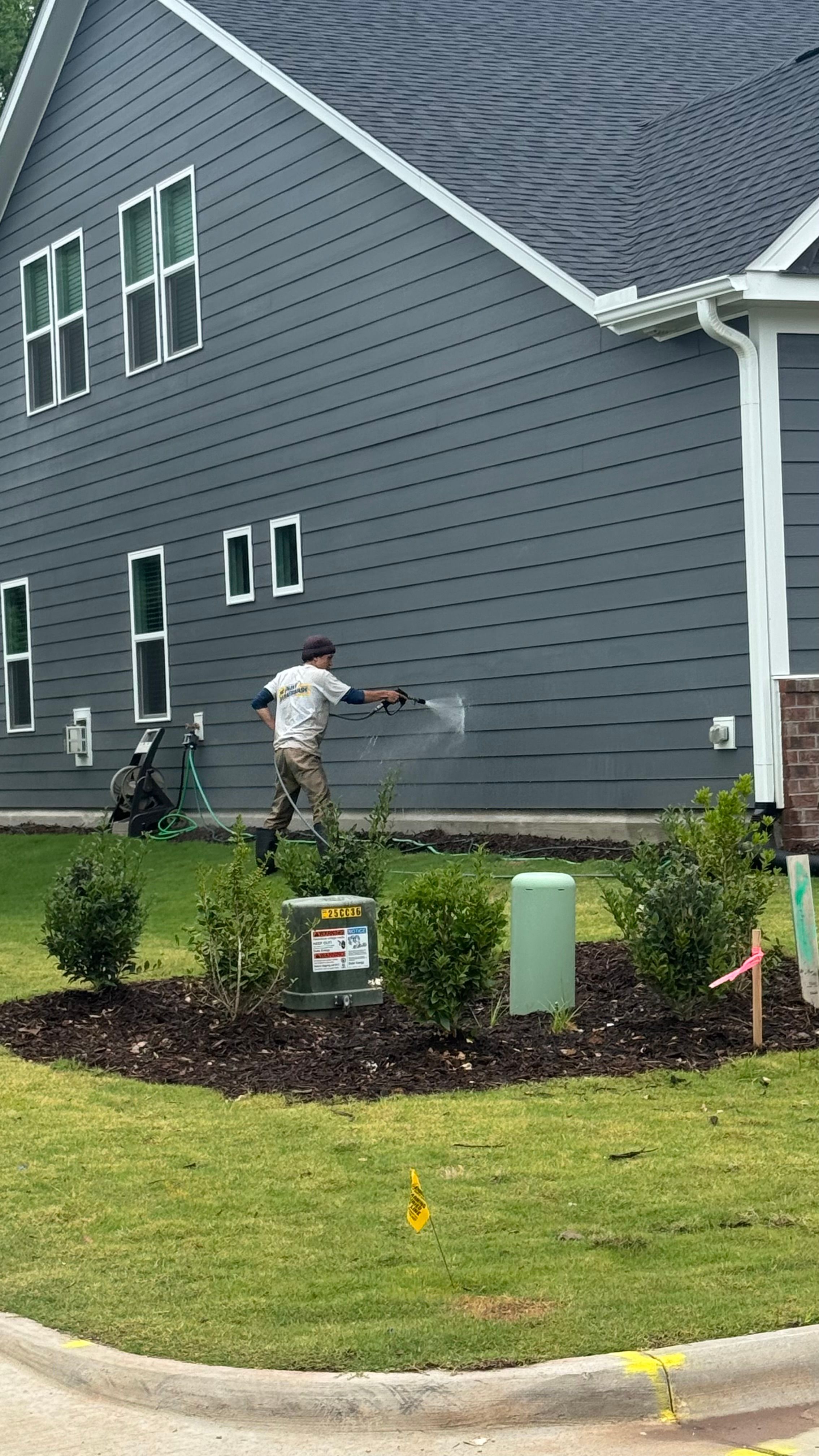 Pressure Washing — home exterior with white siding and black trim in Apex, NC