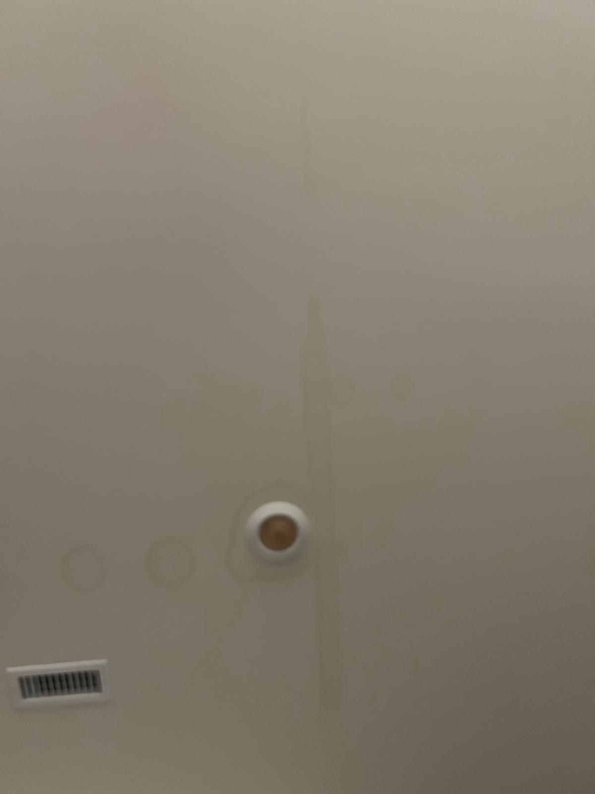 Drywall Repair — freshly skimmed ceiling with recessed light and HVAC vent in Cary, NC