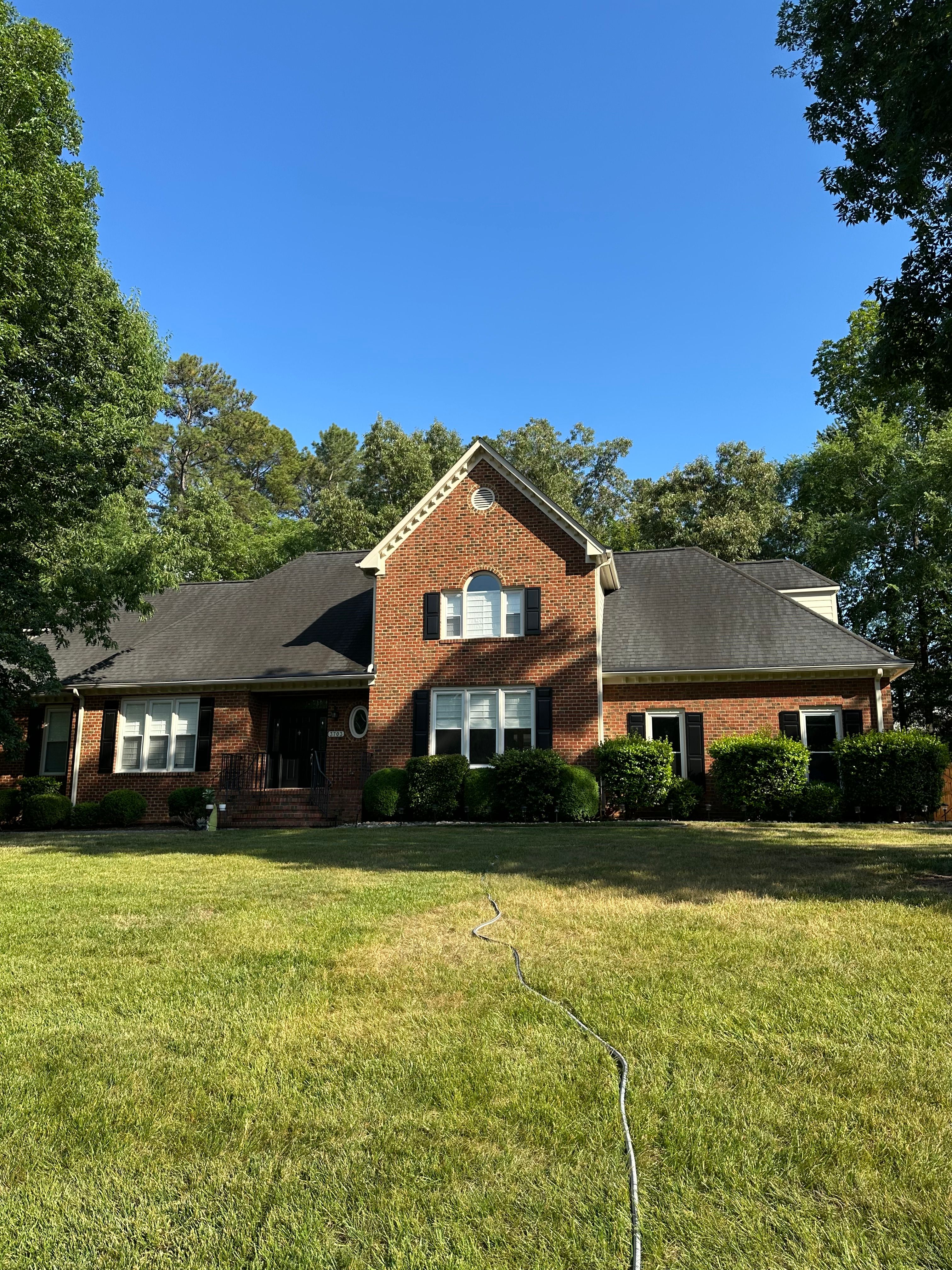 Pressure Washing — crew truck and pressure washing trailer staged at a residential job in Chapel Hill, NC
