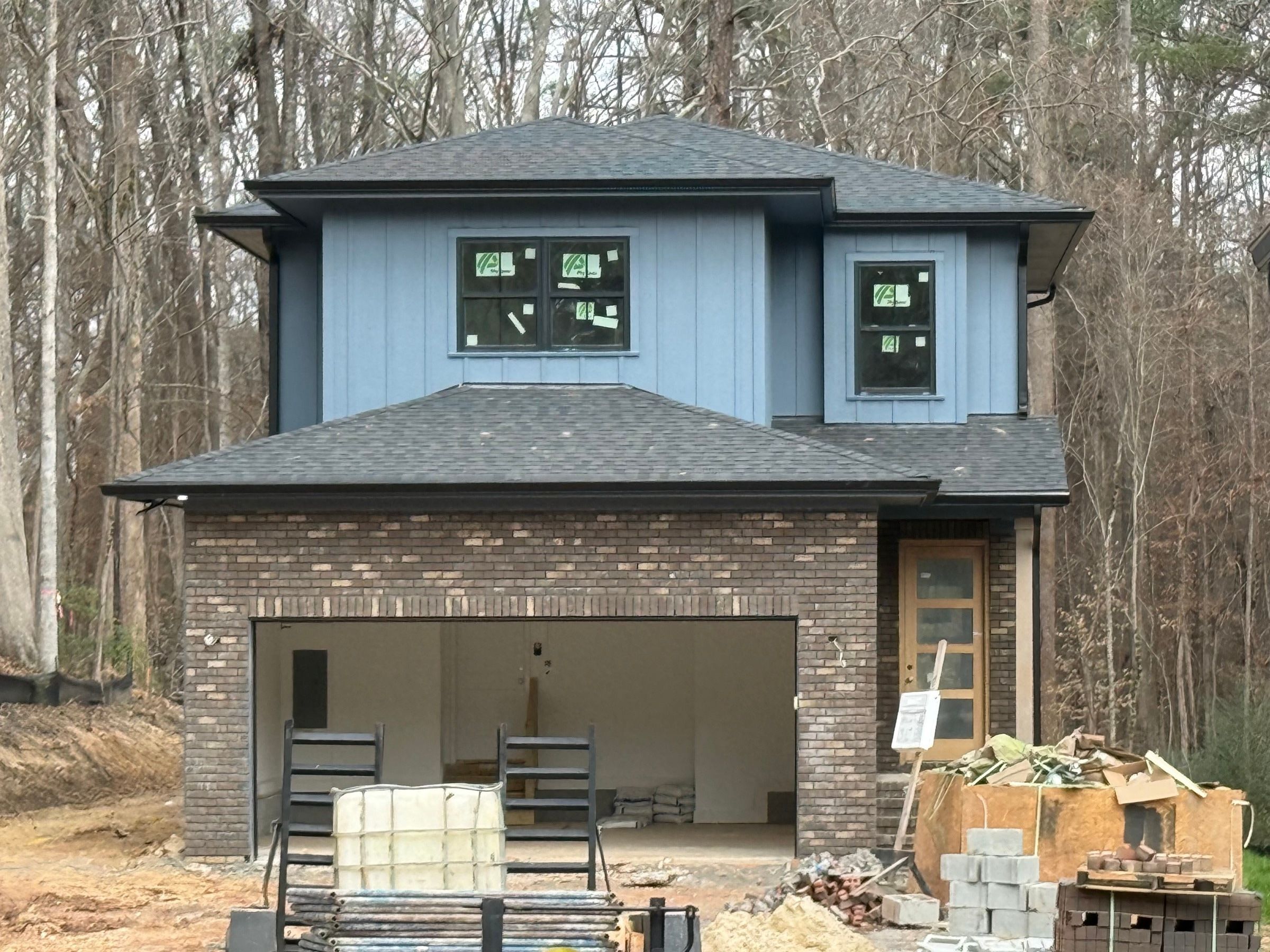 Exterior Painting — new-build blue-gray board-and-batten siding in Durham, NC