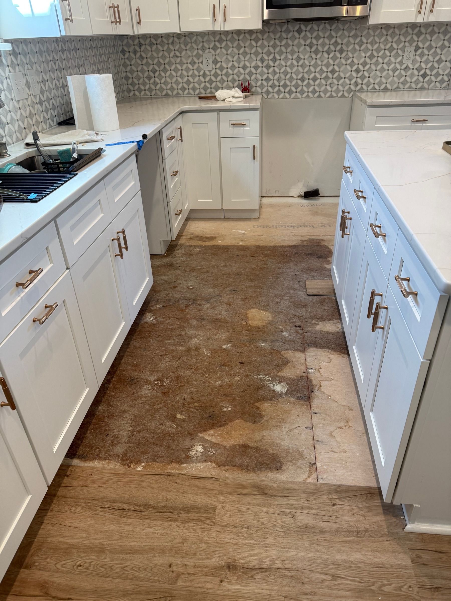Drywall Repair — cabinet doors on countertops, bare drywall behind range hood in Durham, NC
